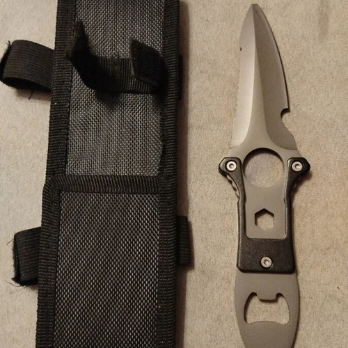 Stainless steel knife new with sheath and saw blade