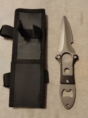Stainless steel knife new with sheath and saw blade