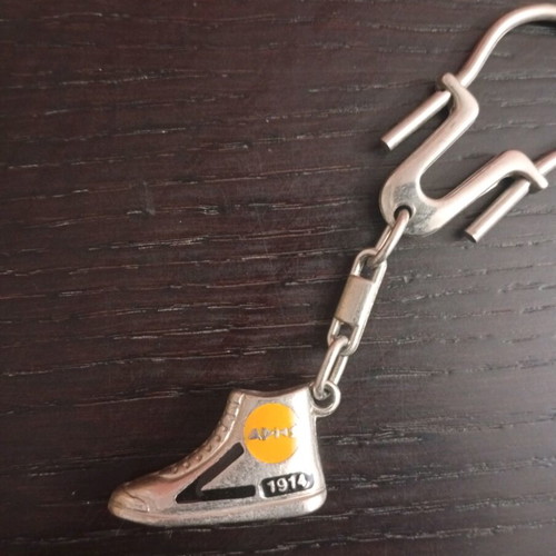 Vintage metal Aris sneaker keychain used