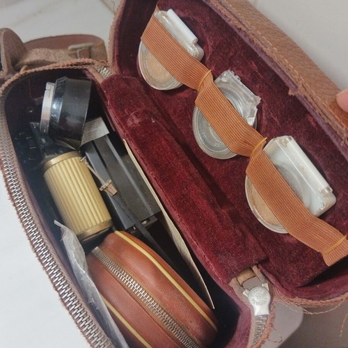 Vintage camera accessories in leather case used