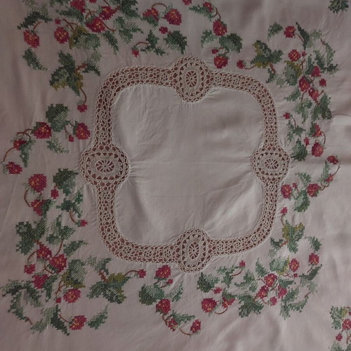 Handmade counted embroidery with handmade lace used