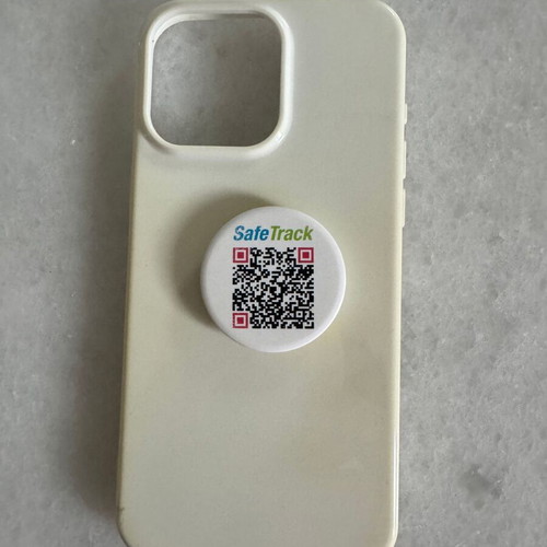 iPhone 15 Pro Max white case used with finger grip holder