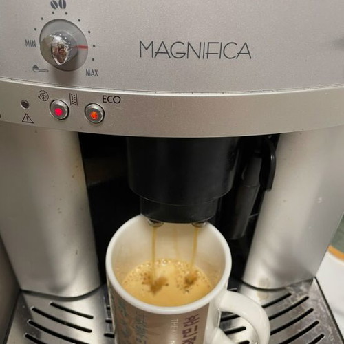 Delonghi Magnifica coffee maker used with grinder and milk frother