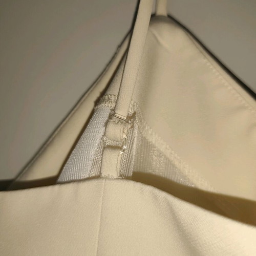 Access jumpsuit extra small white used with minor strap defect