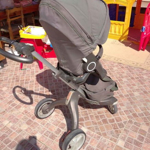 Stokke stroller with scooter, cup holder, umbrella and car seat