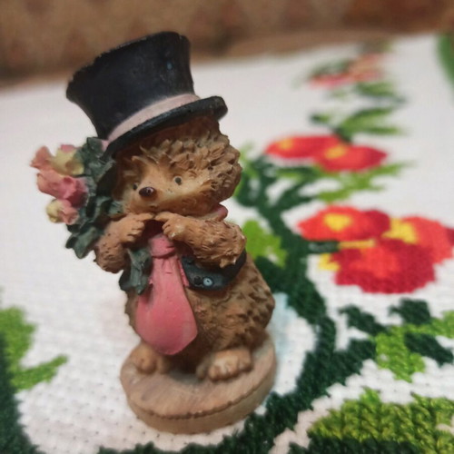 Hedgehog miniature figurine used, decorative with hat and flowers