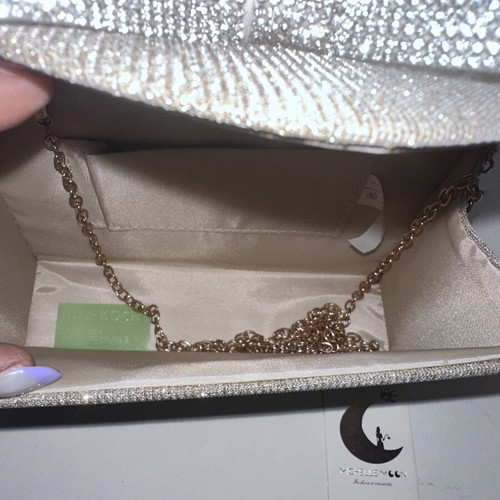 Silver evening clutch with sparkling bow, new