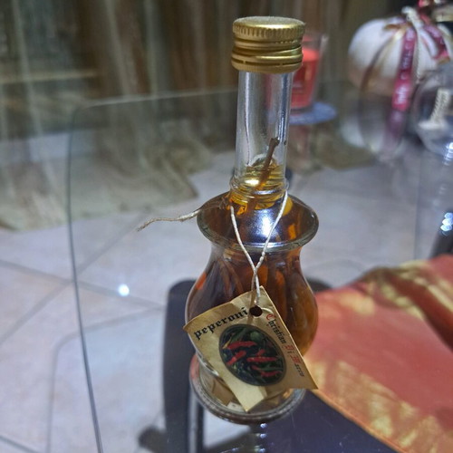 Italian liqueur Cristian di Marko with chili pepper cluster new