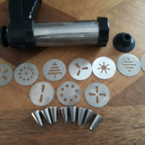 Biscuit press set used with 8 pastry nozzles and 10 dough designs