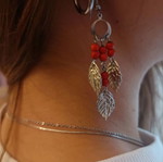 Dangling earrings with red beads and leaves like new