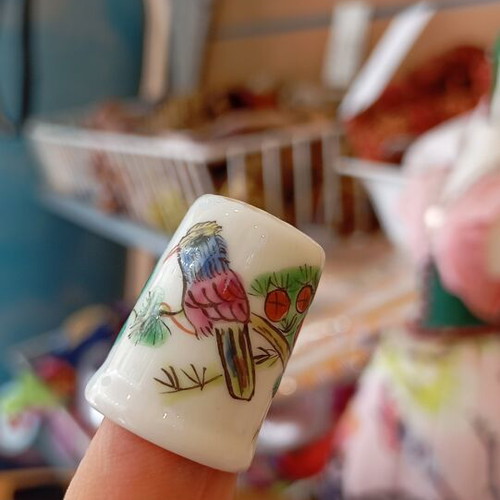 Porcelain thimble like new with bird design