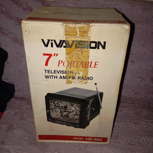 Vintage portable black and white television with radio like new