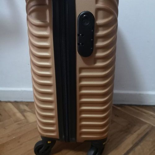 Small suitcase new, gold color