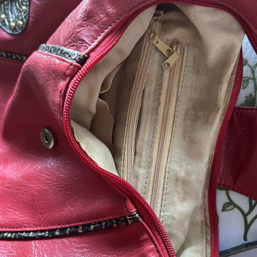 Red hobo shoulder bag like new with decorative details