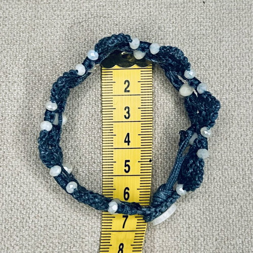 Handmade macrame bracelet with white beads, dark blue