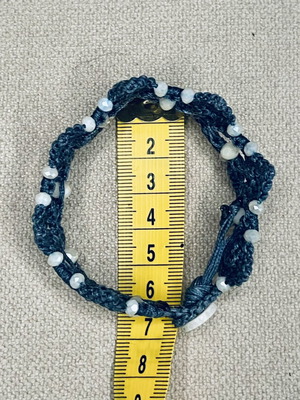 Handmade macrame bracelet with white beads, dark blue