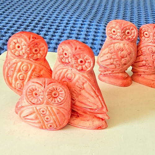 Set of five salmon pink owl figurines