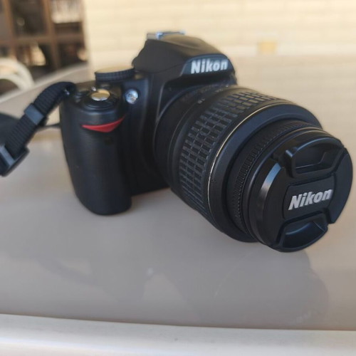 Nikon D3000 camera with AF-S 18-55mm f/3.5-5.6 lens and bag