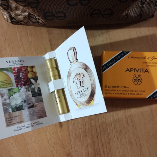 Mini toiletry set with brown-gold cosmetic bag, Apivita soap, Versace Eros Pour Femme sample