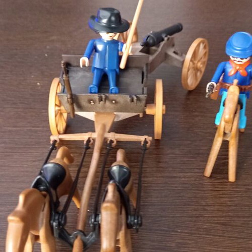 Playmobil Western toy with curved pole between horses