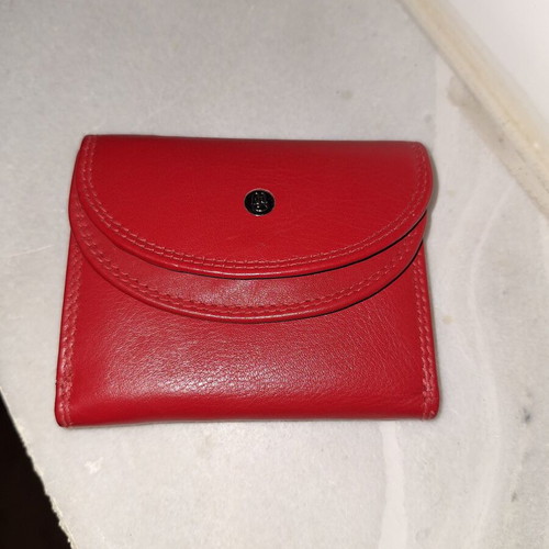 Small red wallet with coin and bill compartments