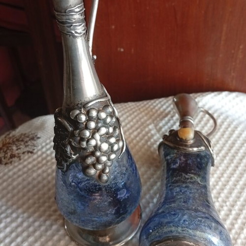 Vintage decorative silver pitchers with blue blown art glass