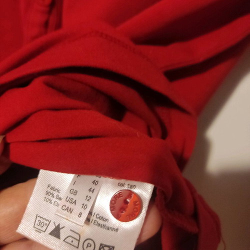 More red elastic blouse with long sleeves and deep neckline new