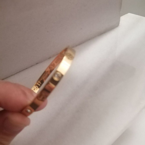 Steel bracelet with clip and rhinestones, gold color