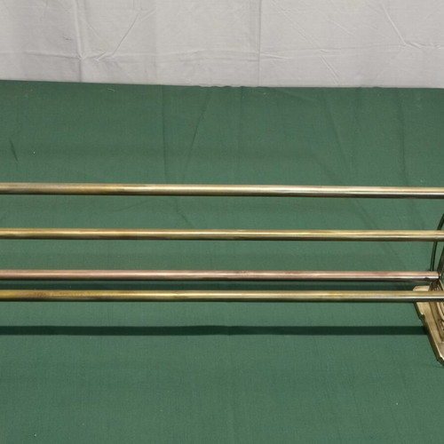 Brass wall-mounted hanger used