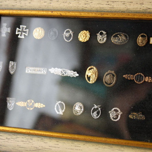 Frame with 27 old German Nazi military badges from World War II like new