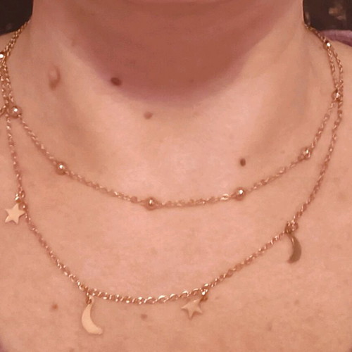 Double necklace in gold color like new with stars and crescent moons