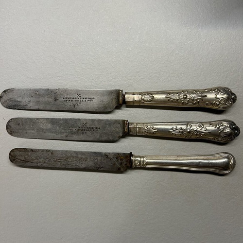 Vintage knives used with silver and silver-plated handles by Christofle and Anowill & Sons Sheffield