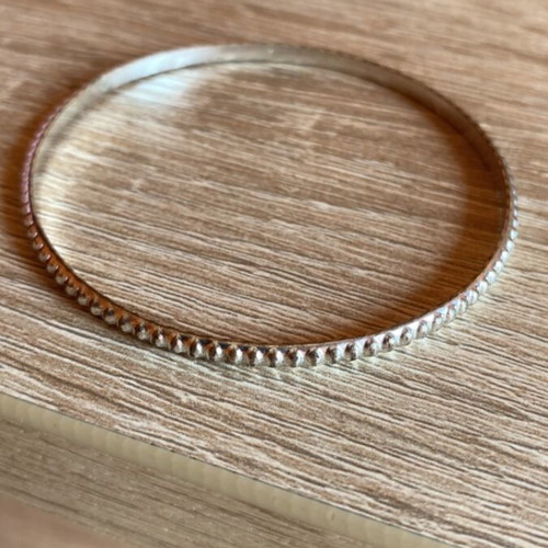 Metal bracelet like new, silver color with rounded protrusions