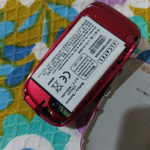 Alcatel vintage flip phone used, red, charger included