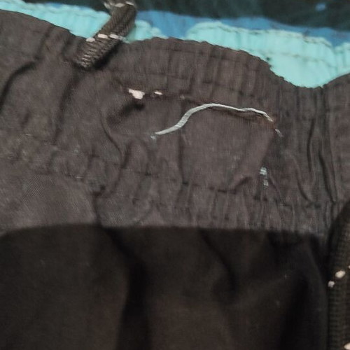 District swim shorts used, black and turquoise, size M, defect