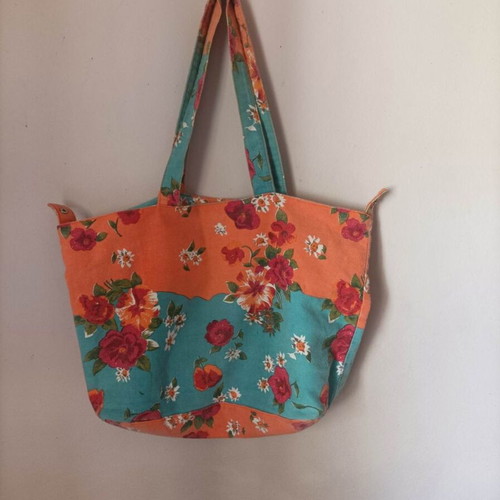 Set of seven multicolor bags including two blue backpacks and one black shoulder bag