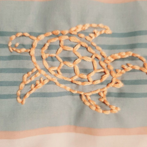 Decorative pillow with golden hand embroidery and sea motifs, new