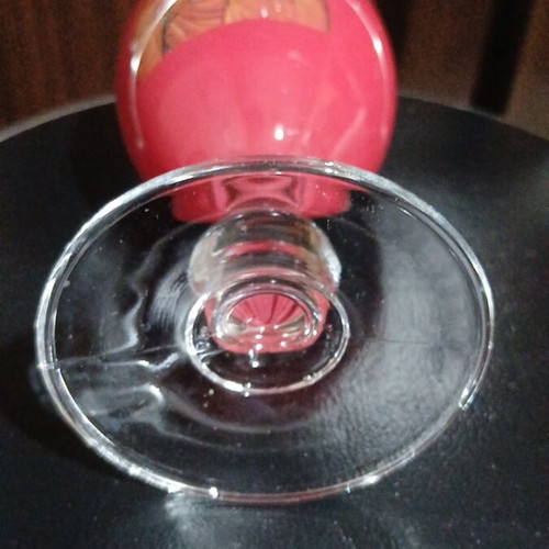 Red glass candlestick with double saints depiction, 17cm