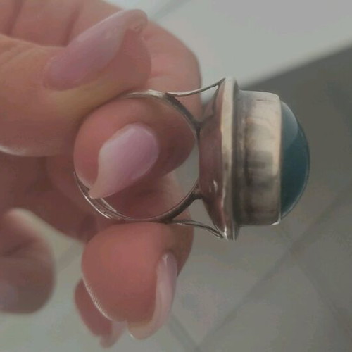 Silver large ring with petrol oval stone used