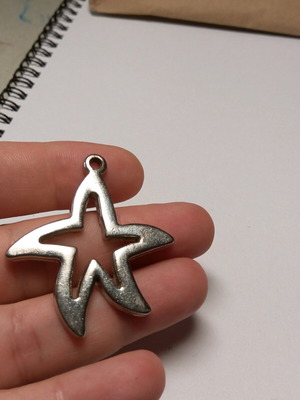 Metal star motif like new, silver tone 4x4.5 cm