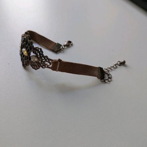 Bracelet with leather strap like new with metal clasp and rhinestones