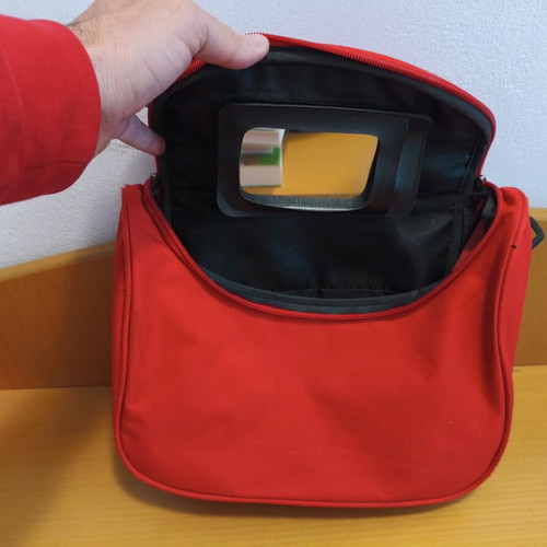 Toiletry bag used, red, practical and spacious travel case