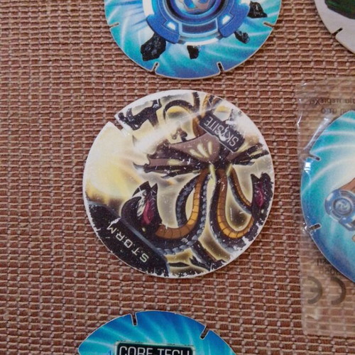 Cheetos Monsuno and Transformers collectible caps, pack of 7, new