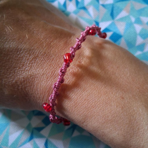 Macrame bracelet with decorative red beads, like new