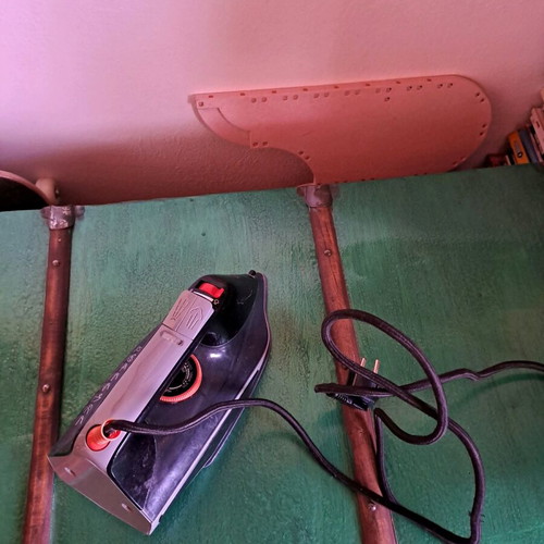 Steam iron used, as shown