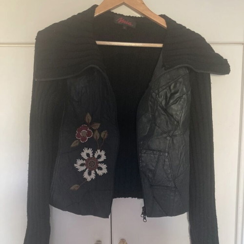 Vintage leather jacket used with knitted wool sleeves and embroidered details