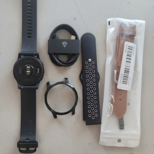 Garmin Vivoactive 4 smartwatch used, with charging cable and straps
