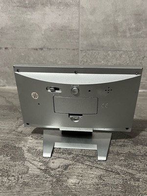 Digital table clock used with alarm and thermometer