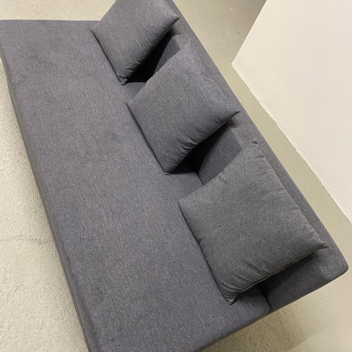 Three-seater sofa bed like new with storage space and 3 cushions