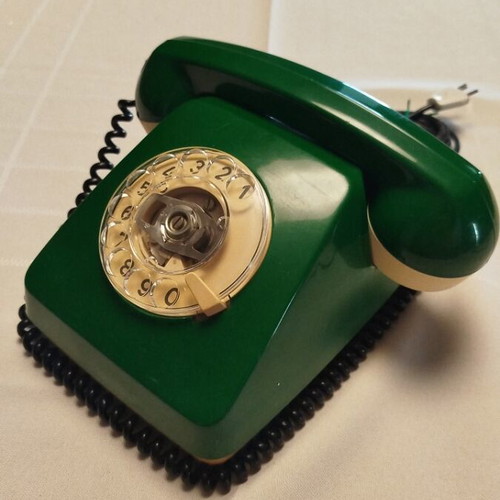 Old green wired telephone, functional